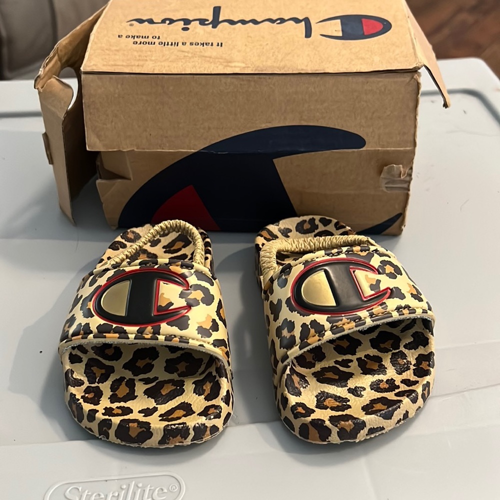 Champion used size 4 black leopard